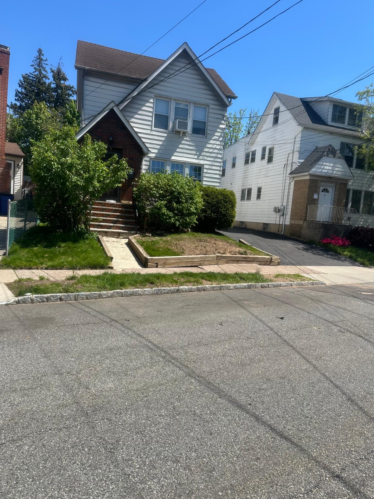 After tree removal in Bloomfield NJ - clean property with tree completely removed